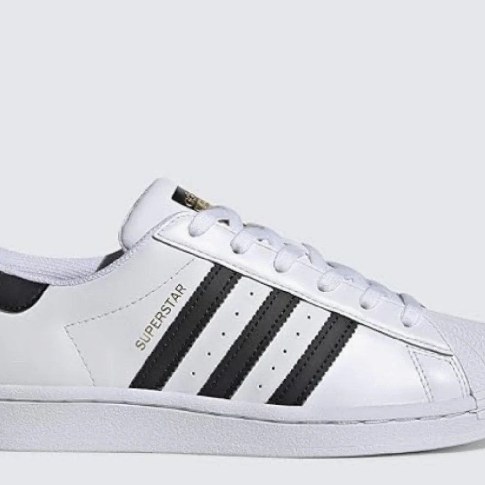 adidas Women’s White Sneakers with Black Stripes